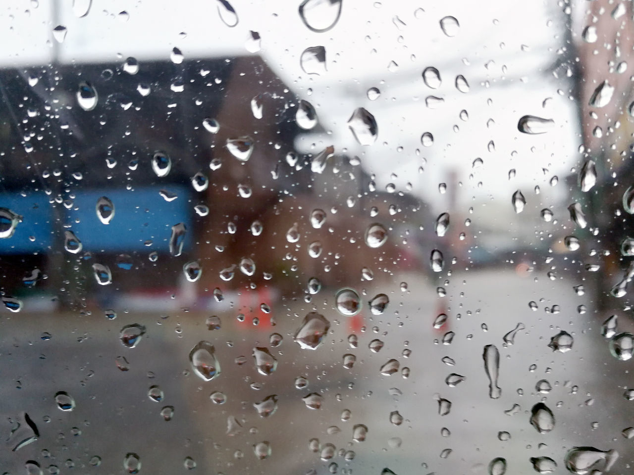 FULL FRAME SHOT OF WET WINDOW IN RAINY SEASON