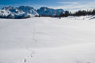 Scenic view of snowcapped mountains against sky