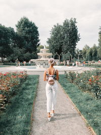 Full length of woman on footpath against sky
