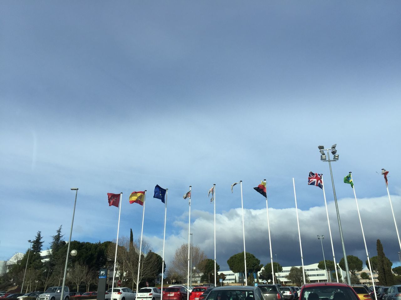 LOW ANGLE VIEW OF FLAGS AGAINST CLEAR SKY