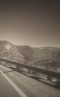 View of mountain road against clear sky