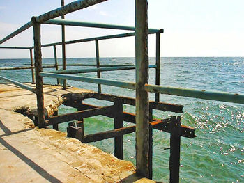 View of pier on calm beach