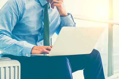 Low angle view of man using mobile phone