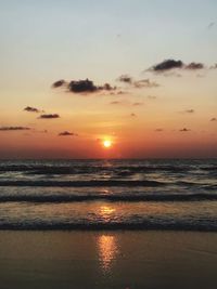 Scenic view of sea against romantic sky at sunset