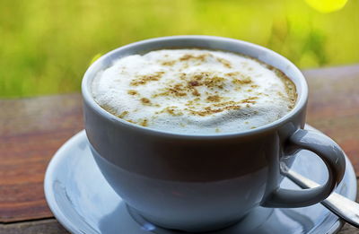 Close-up of coffee cup on table