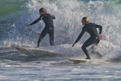 Full length of men in sea