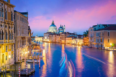 Canal amidst buildings in city