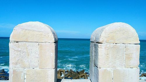 Scenic view of sea against clear blue sky