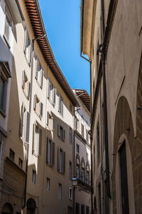 Low angle view of old residential buildings in florence