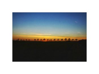 Silhouette landscape against sky