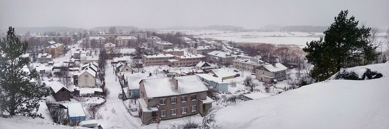 High angle view of snow covered trees against sky