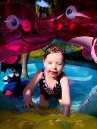 Portrait of a smiling girl in swimming pool