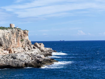 Scenic view of sea against blue sky