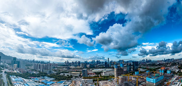 High angle view of buildings in city against sky