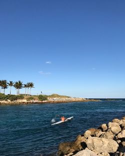 Scenic view of sea against blue sky