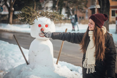 Woman with hat on snow