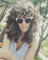 Portrait of young woman in sunglasses