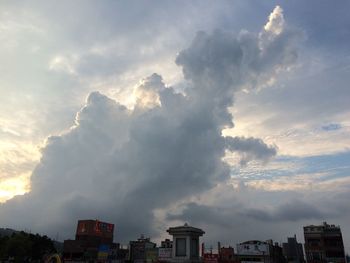 Low angle view of built structure against cloudy sky