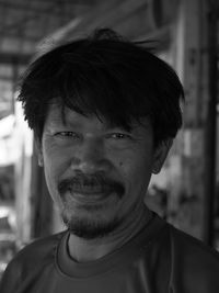 Close-up portrait of smiling mature man