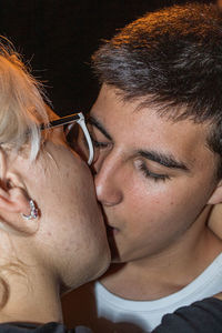 Close-up portrait of couple kissing