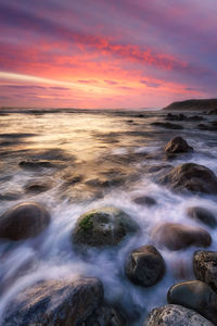 Scenic view of sea against sky during sunset