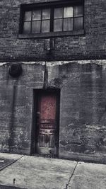 Brick wall with closed door