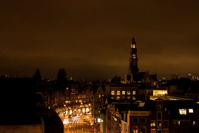 High angle view of illuminated buildings in city at night