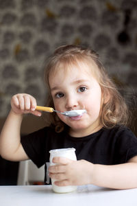 Portrait of cute girl eating food