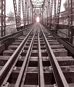 Railroad tracks along bridge