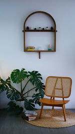 Empty chairs and table against wall at home