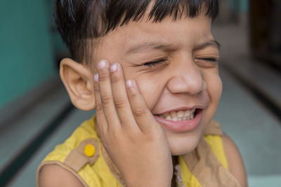 Close-up portrait of boy smiling