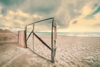 Scenic view of beach against sky during sunset