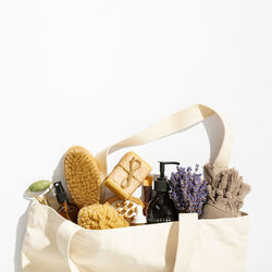 Directly above shot of cleaning products over white background