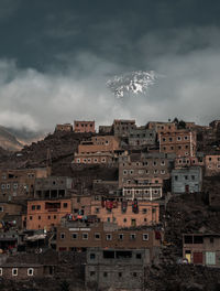 Low angle view of buildings in town against sky