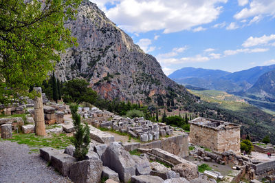 View of castle on mountain against cloudy sky