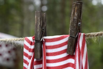 Close-up of clothes drying on wooden post