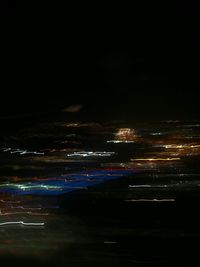Aerial view of illuminated city at night
