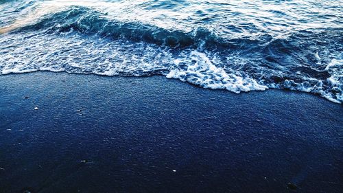 High angle view of surf on beach