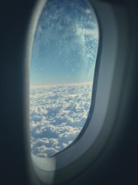 Aerial view of landscape seen through airplane window