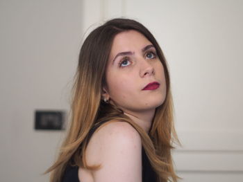 Close-up of beautiful woman at home