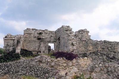 Old ruin building against cloudy sky