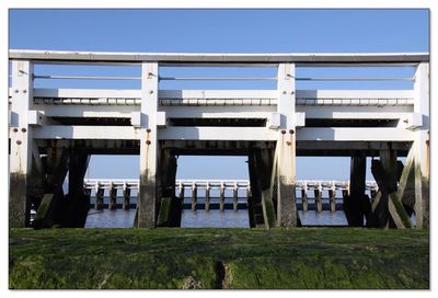 View of bridge against clear blue sky