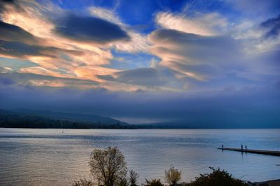 Scenic view of sea against cloudy sky