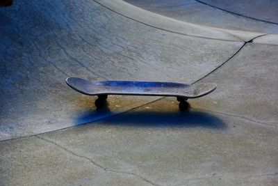 High angle view of skateboard on footpath