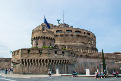 Group of people in front of historical building