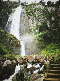 Scenic view of waterfall in forest