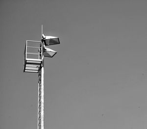 Low angle view of communications tower against sky