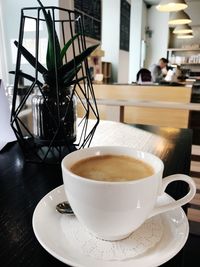 Close-up of coffee cup on table