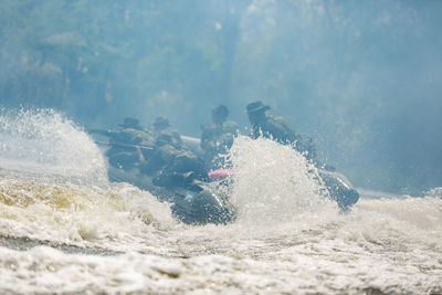 Army soldiers river rafting 