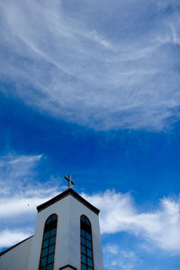 Low angle view of building against blue sky